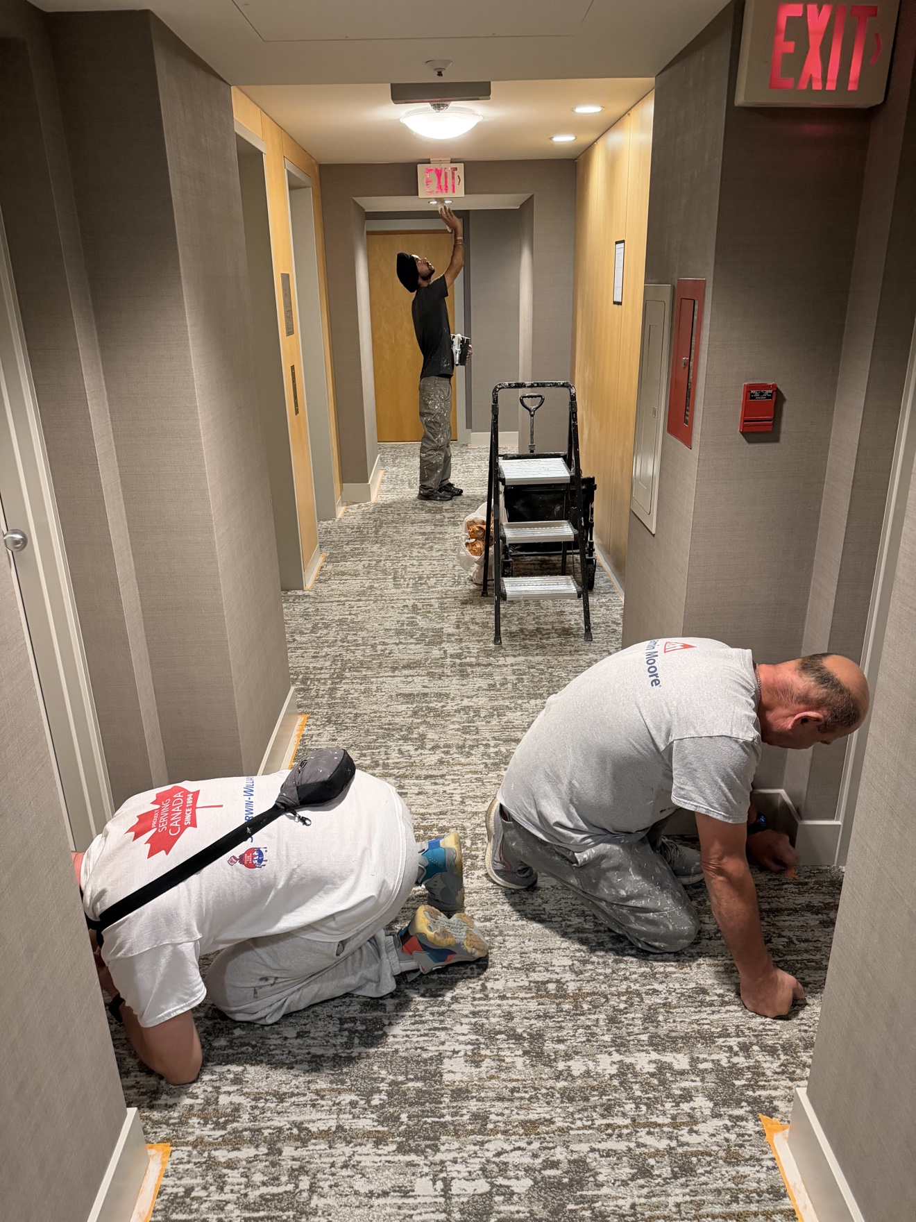 Hotel hallway repaint in progress by Exceptional Painting Inc