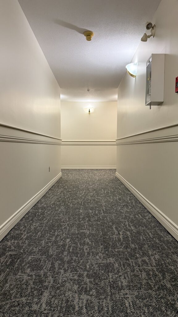 Repainted common-area doors at 15555 16A Avenue, Surrey