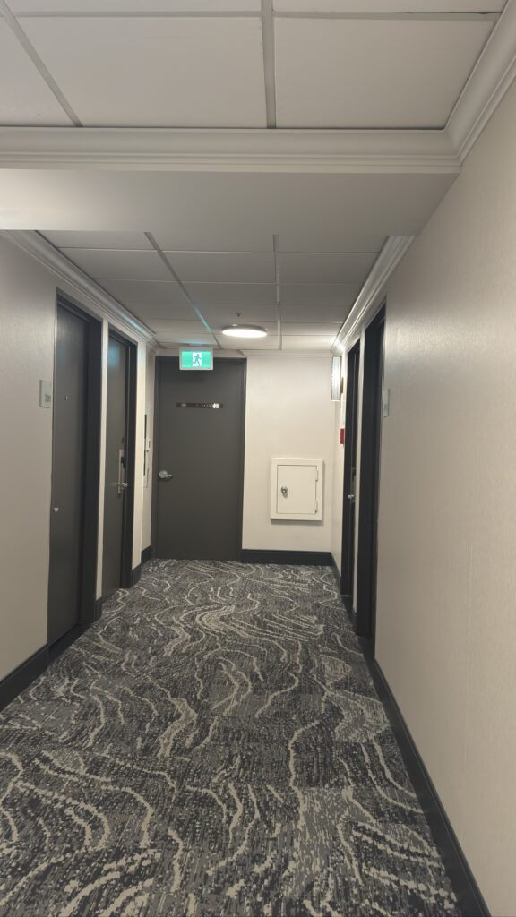 Finished hotel hallway with new paint and carpet — Holiday Inn Downtown Vancouver