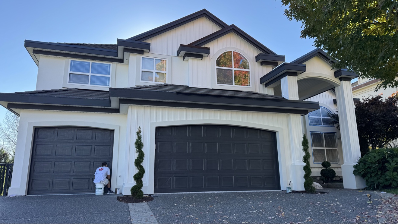 Exceptional Painting painter working on a garage exterior in West Vancouver