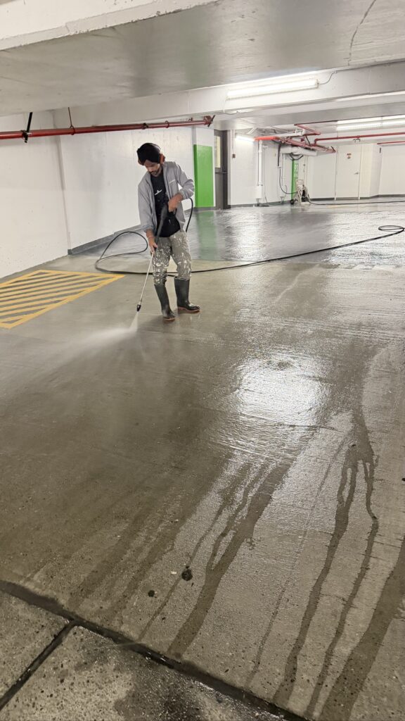 Power washing the parkade floor at Holiday Inn Downtown Vancouver