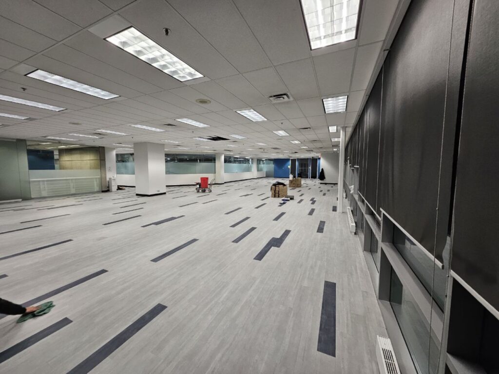Large commercial office space during renovation by Exceptional Painting