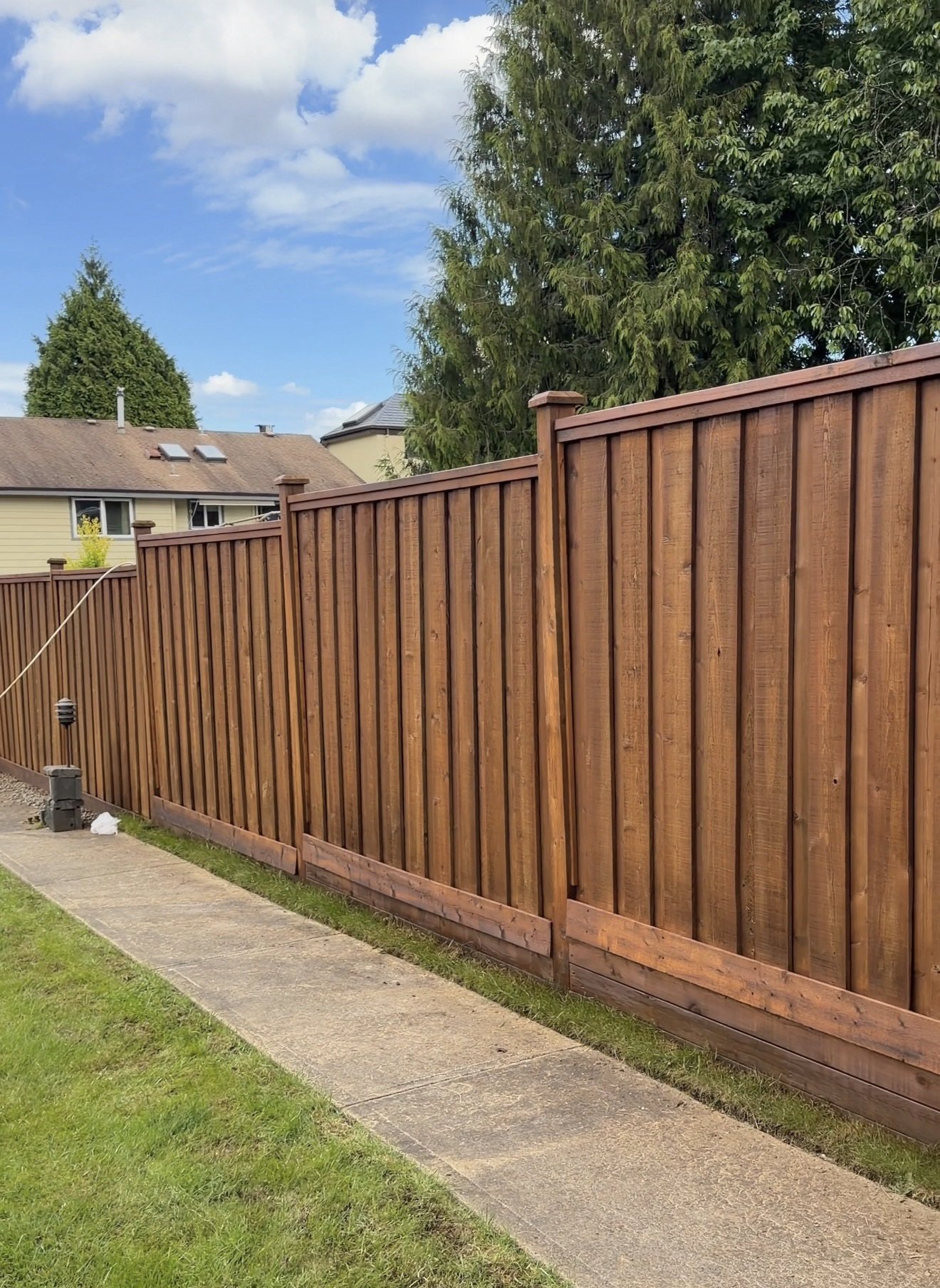 Wooden fence after staining and finishing by Exceptional Painting