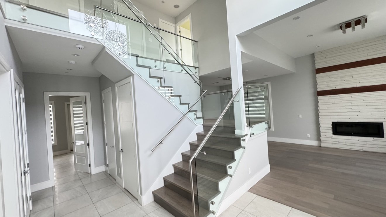Freshly painted modern interior with glass staircase in Langley