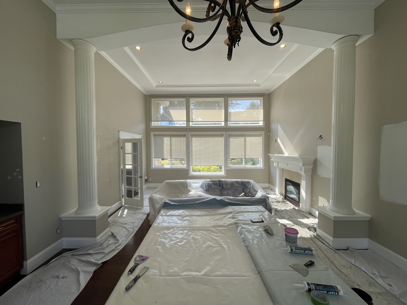 Living room interior being prepped for painting in a Port Moody home