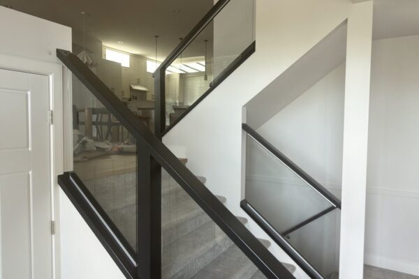 Staircase with black painted railing interior Vancouver BC