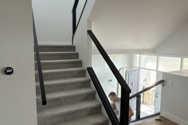 Modern staircase with glass railing interior painting Vancouver BC
