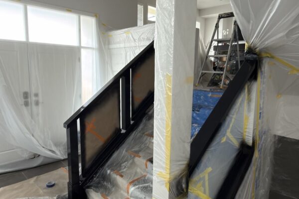 Staircase protected with masking during spray painting Vancouver BC