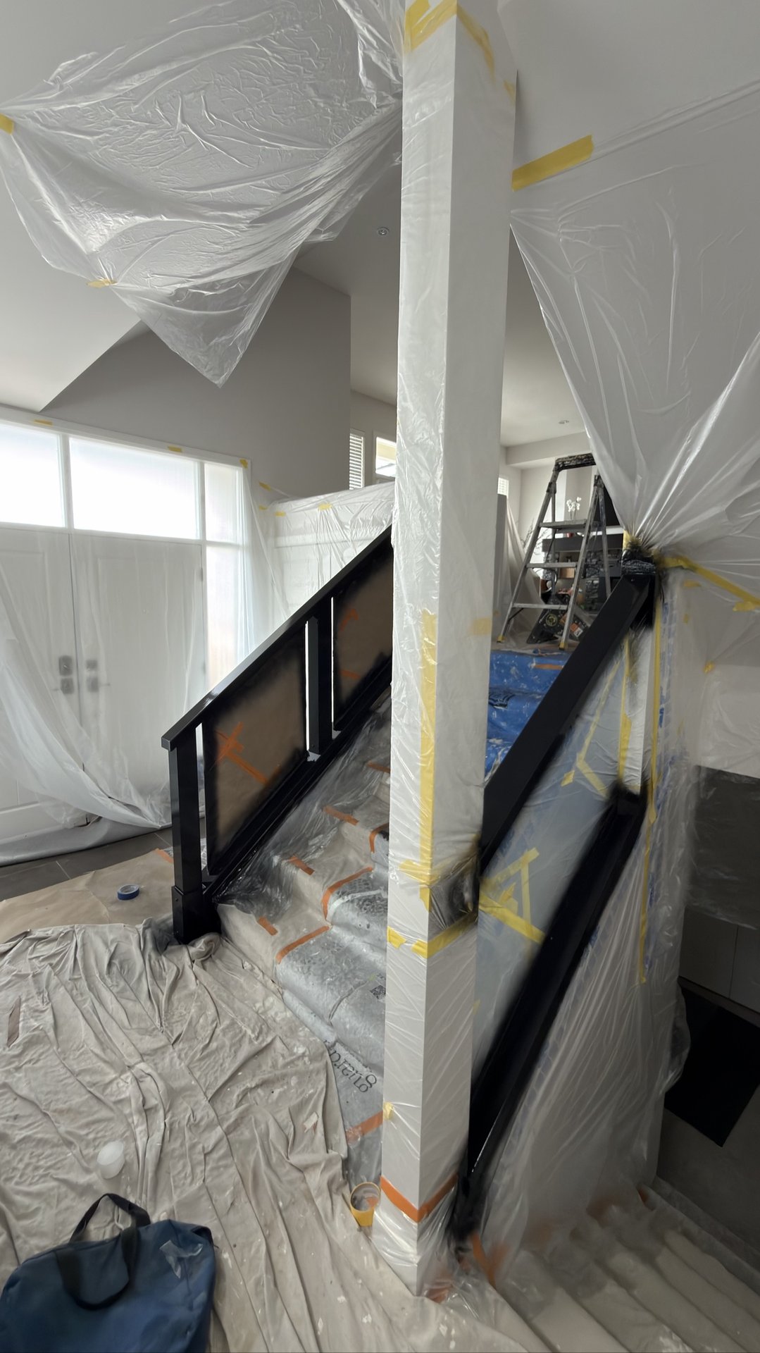 Staircase prepared for spray painting by Exceptional Painting
